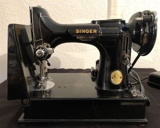Vintage Singer Portable Electric Sewing Machine
Comes with Carrying Case and Manual
Tested and works great!