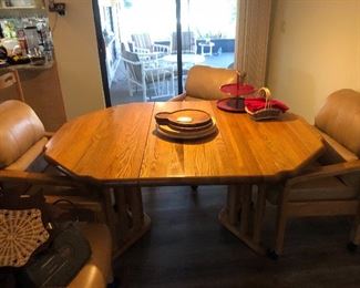 Table with a leaf and 4 rolling chairs $450