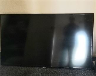Several large flat screen TV's