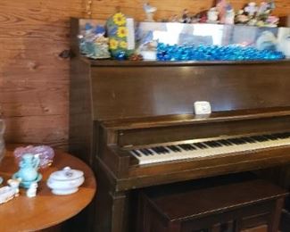 Piano with glass blue bird collection