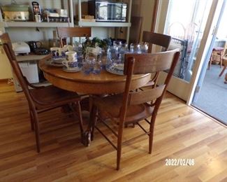 round vintage kitchen table w/claw feet & 4 vintage oak chairs