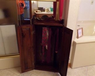 small cabinet, hangs,