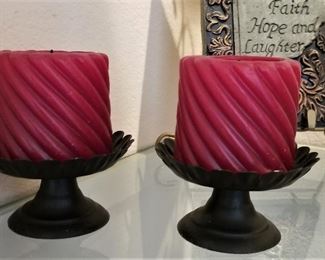Red candles with black metal holders. These pair great with the modern glass elephants.