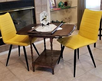 Yellow chairs (there are a set of 4) with folding wooden vintage table.