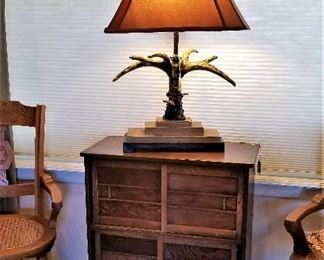 Southwest steer horn lamp and antique Asian Tea Cabinet.