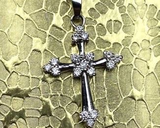 For your consideration is this Elegant 14k White Gold and Diamond Small Cross Pendant Necklace.  This piece is super bright, in overall very nice condition and it really shows nicely.  It features 17 brilliant round genuine diamonds (appox .25ctw).  The pendant measures 3/4" tall and 5/8" wide.  Included is a matching 14k White Gold 18" box link necklace chain with a secure lobster clasp.  This is a signed DJI piece and both the pendant and necklace have the appropriate 14k gold and maker hallmarks.  This is a beautiful cross with an elegant design and would make the perfect gift or nice addition to any fine jewelry collection! 