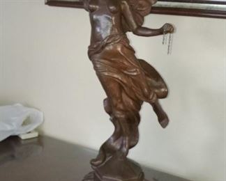 Lucretia Cue as bronze statue