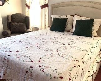 Beautiful quilt with matching pillows and curtains.