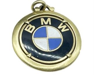 Lot 303
18K BMW Logo Signed Pendant 18.4 g