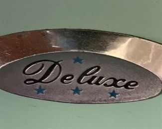 #54	Blue Deluxe Sewing machine in a mid-century Cabinet 	 $125.00 
