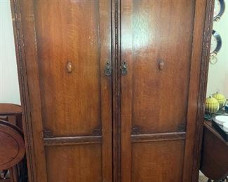 #70	Antique Wardrobe w/Shelves & Hanging Rod w/carving and flowers 46x18x70	 $125.00 
