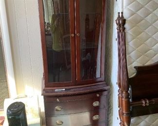 #79	Laminate 2 pc. 4 drawer, Pull-out tray w/2 glass doors, 2 glass shelves lighted Display Cabinet 25x16x69	 $75.00 

