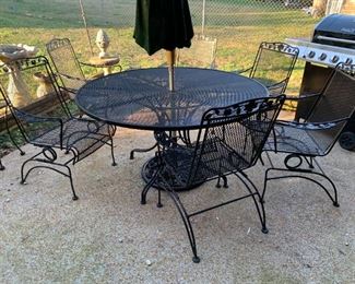 #206	Wrought Iron Round Table w/6 bouncy Chairs & Cast Iron umbrella Stand 54" Round x29"	 $250.00 
