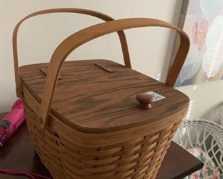 #274	longaberger rectangle basket with flip top 2 handles, plastic liner, and wood stand	 $20.00 

