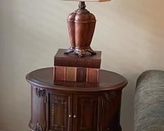 Small console end table w/ 2 cabinet doors.