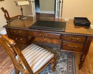 Beautiful desk w/ 5 drawers and desk chair - has a glass top on it to preserve this beautiful piece. (59" W x 28" D).