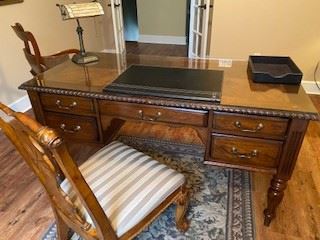 Beautiful desk w/ 5 drawers and desk chair - has a glass top on it to preserve this beautiful piece. (59" W x 28" D).