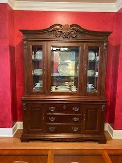Beautiful formal china cabinet that matches dining table. Has 2 cabinets & 3 drawers at the bottom, one comes with felt & designed for silverware.  Glass part of cabinet has inside glass shelves & cabinet doors for placing or removing china - BEAUTIFUL!