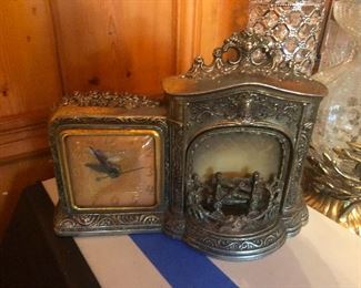 Ooh this is cool. Cast silver clock with a fireplace that lights up