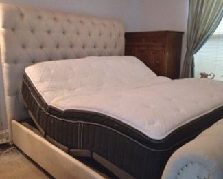 Beautiful king size bed with Serta base and sterns and foster mattress