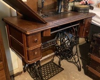 Vintage Singer sewing machine in cabinet