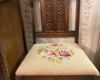 carved chair and embroidered seat