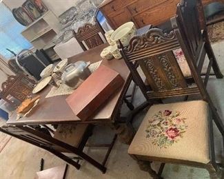 dining table and carved chairs