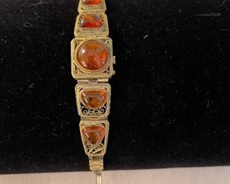 Yanks 17 Kamhem Lady’s watch with gold filigree bracelet featuring Baltic amber stones. Large estate jewelry collection, including Costume, gold, sterling, gemstone.  This is a true estate jjewelry collection. There are some bags of scrap gold available for sale, at market price 1.28.22.