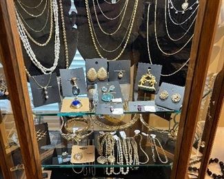 Case of gold and pearl and gemstone jewelry and pearls