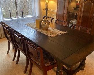 Unique antique dining table with six upholstered  chairs