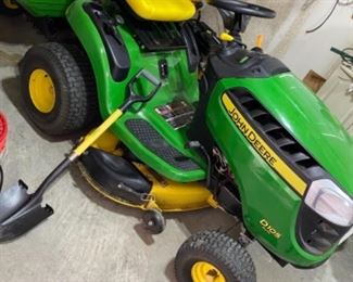 John Deere riding mower in great shape. There is also a pull behind cart priced separate 