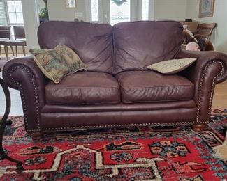 $150 leather loveseat with nailhead trim