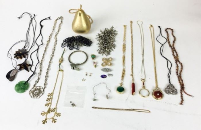 1	Lot of Costume Jewelry	Including gold and silver tone, beaded necklaces, MMA pendants, Yves St Laurent brooch, pear-shaped handbag. Pear 5 1/4"H
