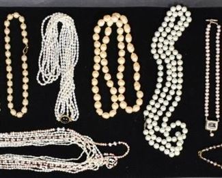 8	Collection of 19 Faux Pearl Necklaces	19 faux pearl necklaces including freshwater water pearls in a variety of colors. Ranging from chokers to long strands. Longest necklace: 29 1/4" Length.
