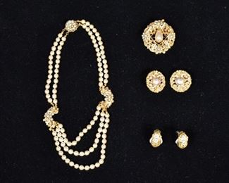 15	Miriam Haskell Gold Tone and Faux Pearl Set	Miriam Haskell faux pearl necklace, brooch and clip on earrings with star motifs and gold tone filagree. Necklace: 8 1/2" length and 4 3/4" diameter.
