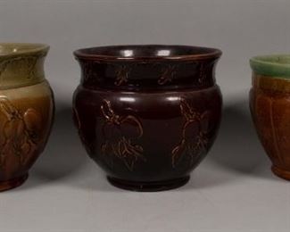 25	3 English Brown Stoneware Planters	3 English brown stoneware planters with harvest motifs. Largest: 9 1/8" H x 9 3/4" Diameter. Lines in 2 planters.
