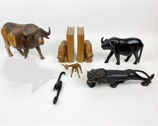 33	Animal Wood Carvings	6 wood carvings of animals - 2 bulls, lion, monkey, giraffe, and a pair of hippopotamus bookends. Largest 9"H, bookends 7 1/2"H x 6 1/2"W
