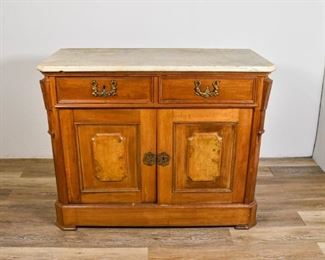 60	Marble Top Walnut Sideboard	Marble top walnut American renaissance sideboard with 2 drawers on top, 2 doors below opening to cabinet. Marble is unpolished. Inside cabinet missing shelf, some chipping to back of marble. 36" H x 45 1/2" W x 21 1/2" D.
