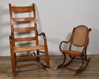 73	2 American Rocking Chairs	2 American rocking chairs. Early 20th Century. A Shaker Style ladderback rocking chair with woven wicker seat, and a diminutive child's rocking chair with caned back and seat. Heavy wear to arms of Shaker chair, loss to front feet. Wear to front feet of child's chair. Largest chair measures 39" H x 20 1/2" L x 30 1/2" W
