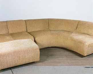130	Mid Century Modern Sectional Sofa	Three piece mid century modern sectional sofa. Small tear, minor staining. Curved piece 28" x 95" (longest point to point) x 36". Straight piece 28" x 42" x 36". Ottoman 17" x 34" x 21"
