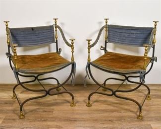 137	Pair of Spanish Savonarola Chairs	Pair of Spanish Savonarola Chairs. Spain, Early 20th Century. Wrought iron frame with brass terminals, blue velvet back, seat and armrests. Stuffing in cushioning is deteriorating , heavy wear to velvet. 34" H x 23 1/2" L x 20" D
