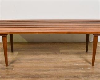 139	Danish Modern Bench	Danish Modern bench. Danish, Mid 20th Century. Teak, 6 slats sitting atop 4 dowel feet which unscrew. Scratches across top of bench, some wear to feet. 13 1/2" H x 48" L x 17" D

