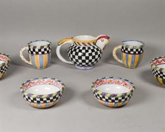 151	7 Pieces MacKenzie-Childs Pottery	MacKenzie-Childs (American, New York, 1983-). 7 pieces of pottery. 2 mugs, 2 small bowls, 2 large bowls, rooster jug. All with impressed MacKenzie-Childs marks to undersides. Larger bowls 3 1/4"H x 7"-diameter, jug 5 3/4"H.
