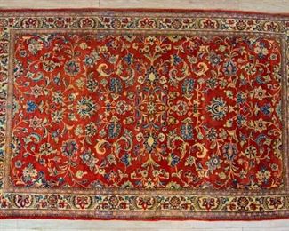 163	Oriental Rug	Oriental rug, wool. Floral - red, beige and blue. 6'9" x 4'3". Fringe appears to be cut down.
