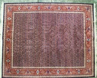 168	Hand Made Room Size Oriental Rug	Room size Oriental rug. Red and blue, scrolling floral motifs and poppy field pattern. 100% wool, with label 1907 Fish All Over. 10' x 8'1"
