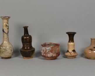 208	7 Pieces Japanese Pottery	7 Japanese studio pottery pieces. 3 short vases, 3 tall vases and a bowl. Line to the opening of the tallest vase. Tallest piece: 10" height. Bowl: 4 1/2" diameter. Crazing to the surface of 3 vases.

