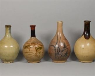 211	Collection of 6 Japanese Pottery Vases	Assortment of 6 Japanese pottery vases, earthen tone glazes from white, brown to green. Tallest vase: 12" height. Crazing to the surface of 5 out of 6 vases.
