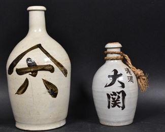 209	2 Japanese Pottery Sake Bottles	2 Japanese pottery sake bottles. Tallest: 10 5/8" Height.

