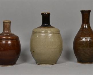 216	3 Japanese Incised Pottery Vases	3 Japanese brown incised pottery vases, each marked on the underside. Reminiscent of Koishiwara Yaki ware. Tallest: 10" Height.
