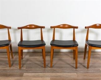 219	Four Peter Hvidt Style Mid Century Modern Chairs	Four Peter Hvidt style (Danish, 1916-1986) Mid Century Modern Chairs. Danish, Mid 20th Century. Bentwood splat, teak, leather cushioning. Scuffs on back of splat of one chair, wear to legs. 30" H x 20" L x 17" D

